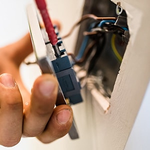 MJF Electrician wiring a socket