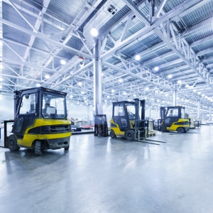 Forklift trucks in a warehouse