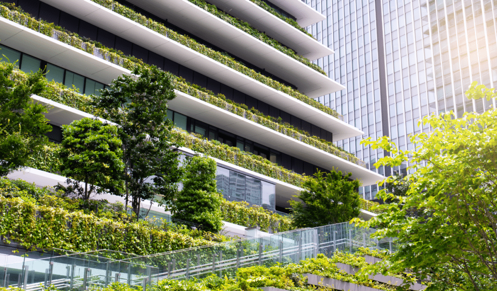 City buildings with green trees and hedges